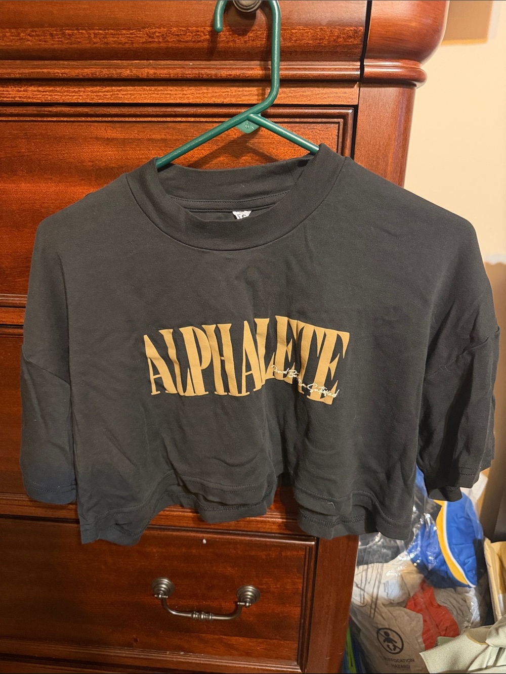 Alphalete Black Cropped Tee with Gold Logo Print